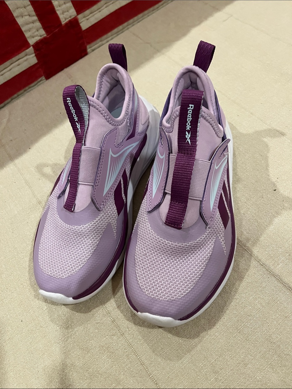 Reebok Girl’s Slip-On Sneakers in Light Lavender and Deep Purple